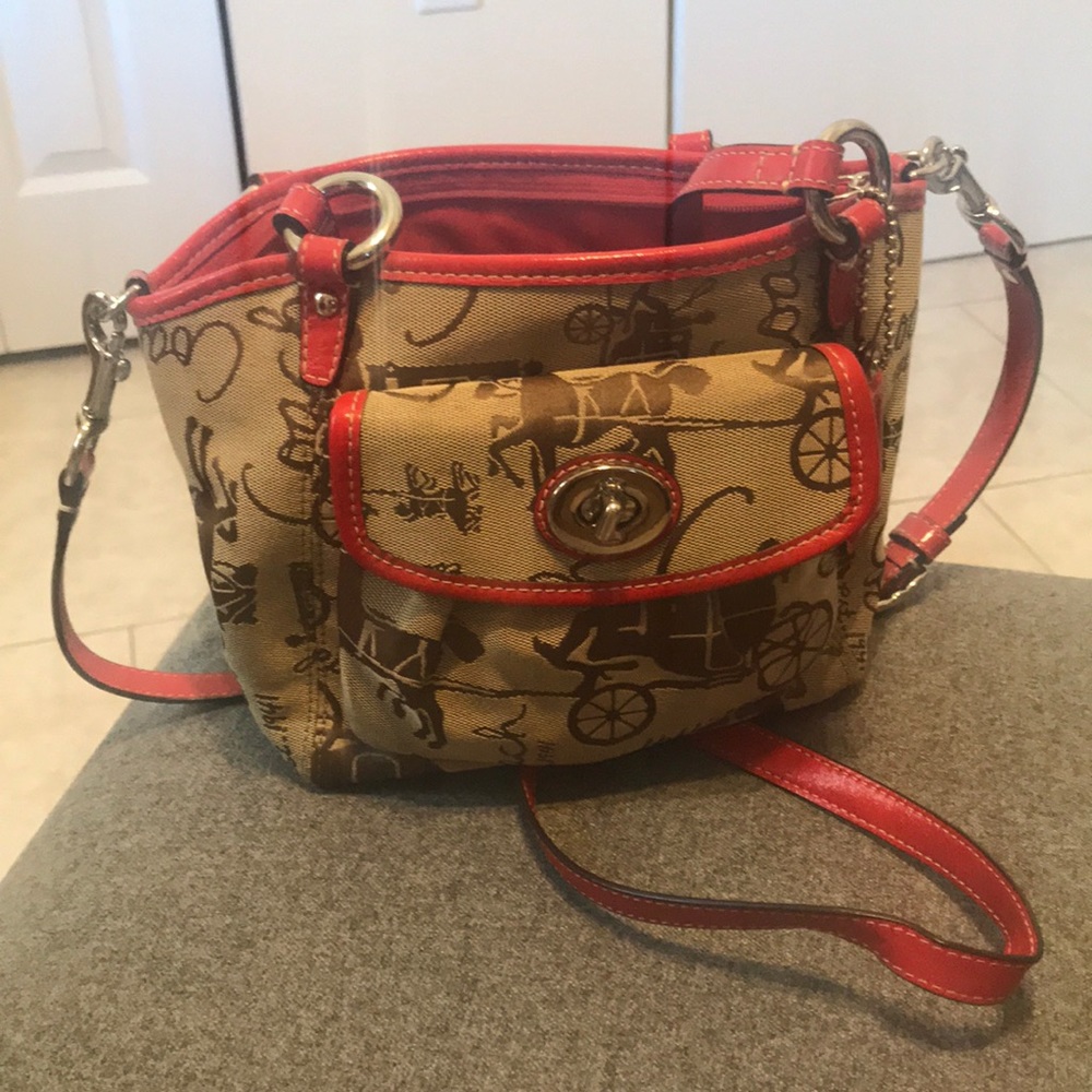 Small Coach shoulder bag with crossbody strap.